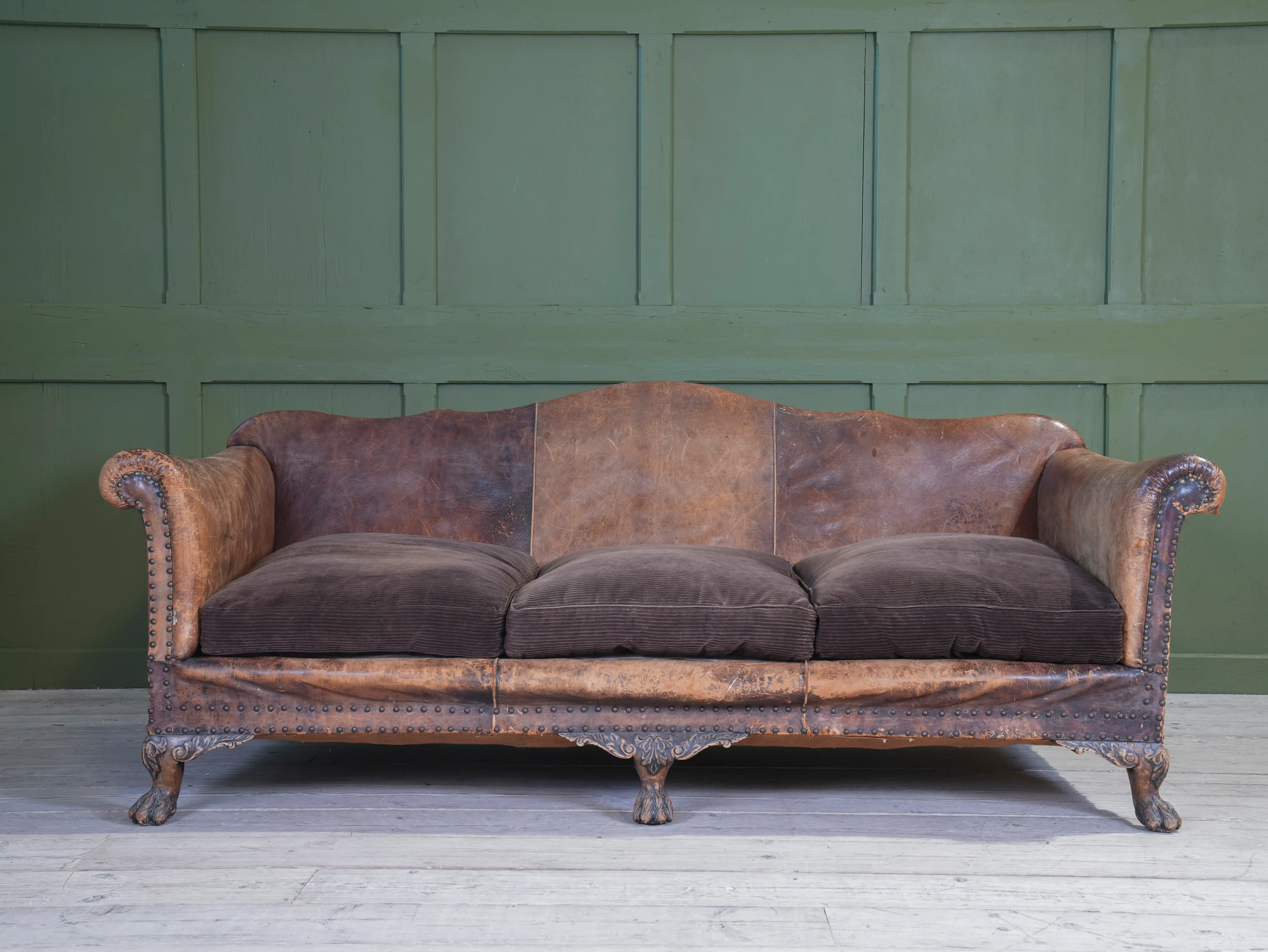 A Large Leather Camelback Sofa - Image 11