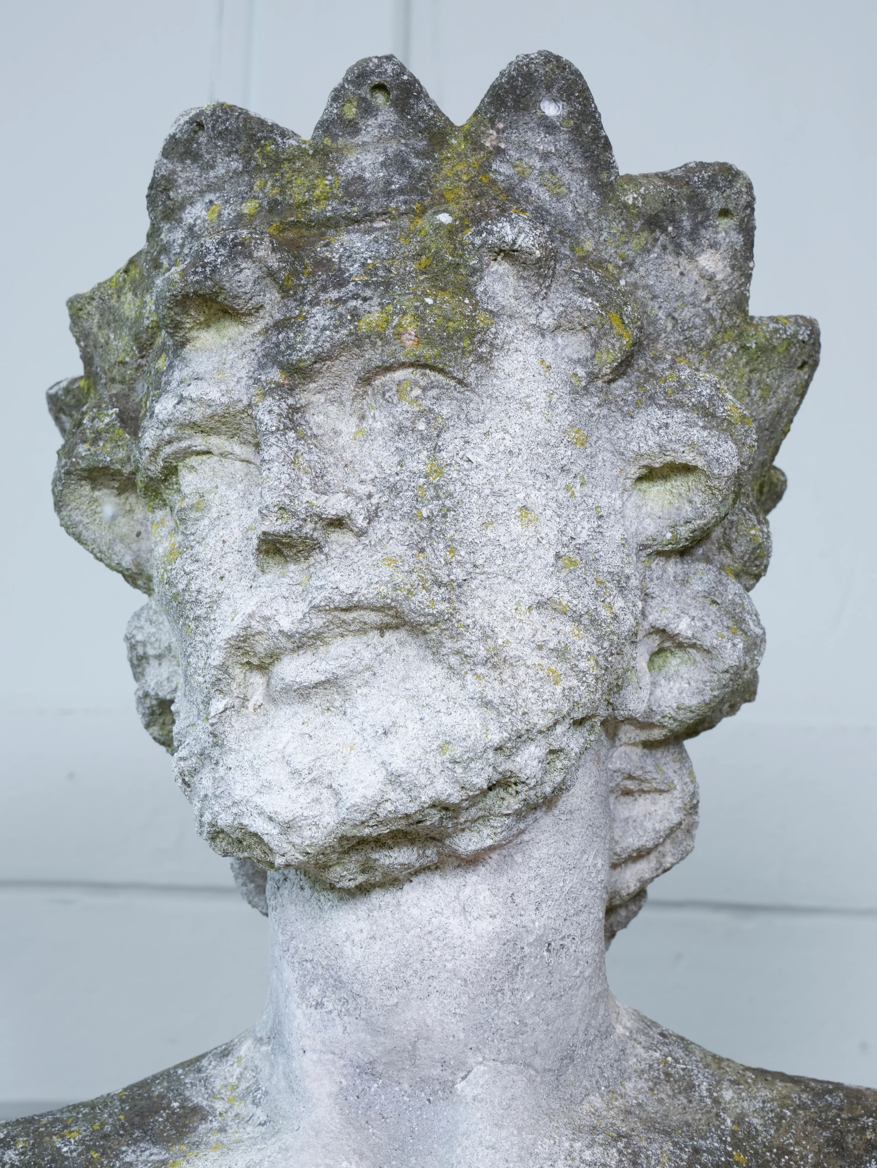 A Carved Stone Standing Male Figure with Crown